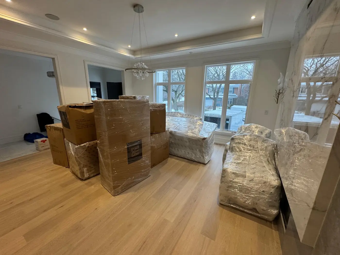 packing and wrapping household furniture for a move in North York