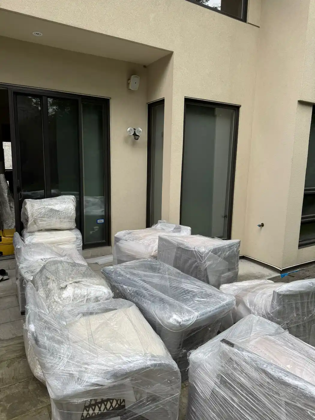 Professional movers discussing moving costs in Mississauga